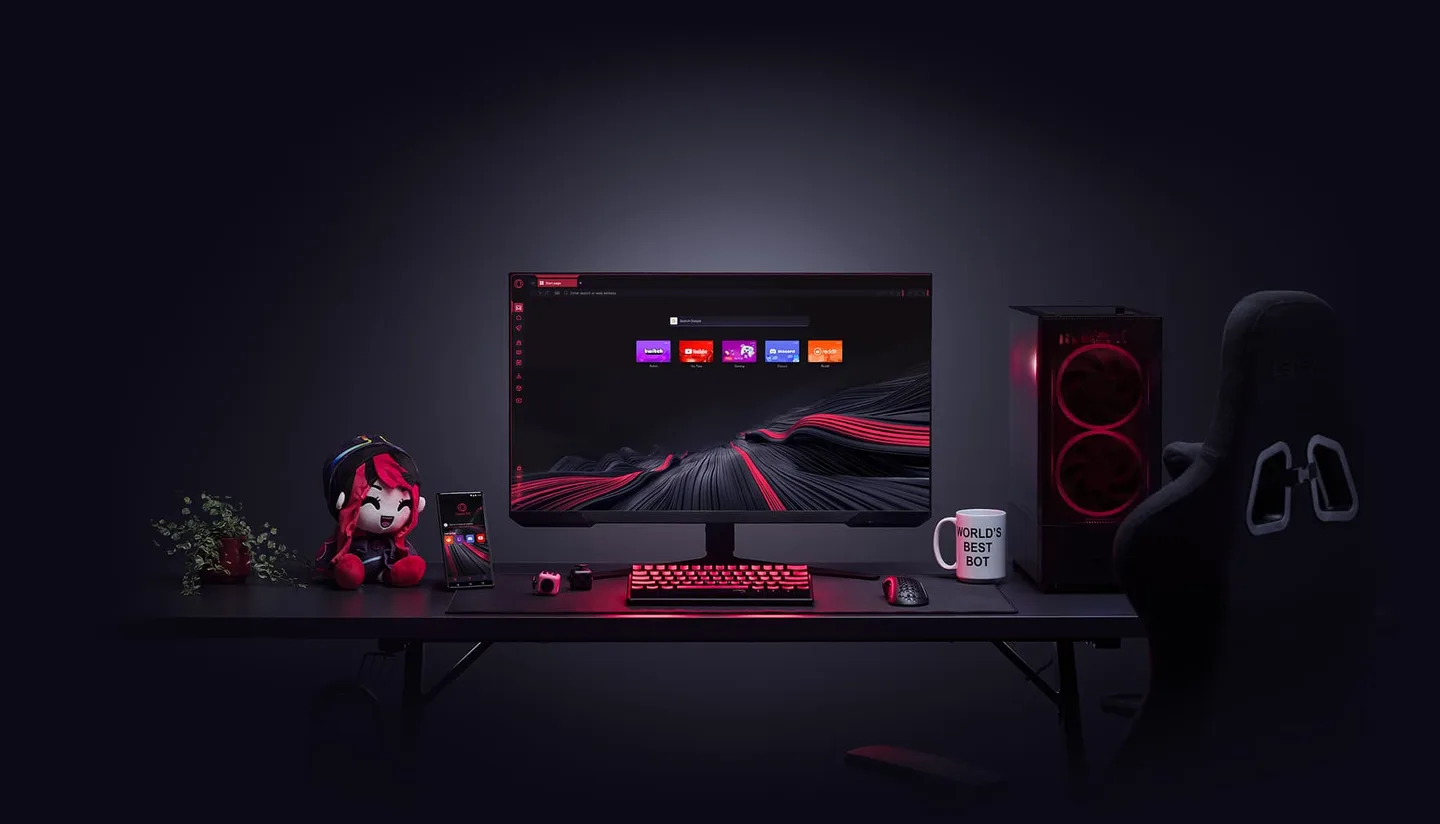 A gaming desk with a monitor showing the Opera GX browser, a PC tower, a keyboard and a mascot plush