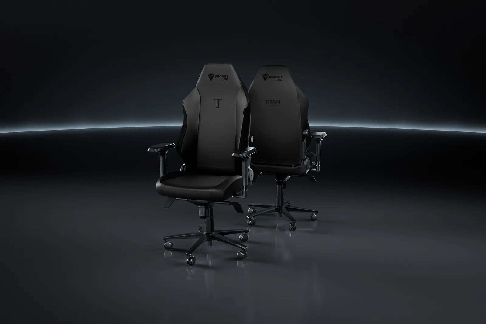Two Secretlab TITAN Evo gaming chairs in black, studio product shot showing the high backrest and adjustable armrests