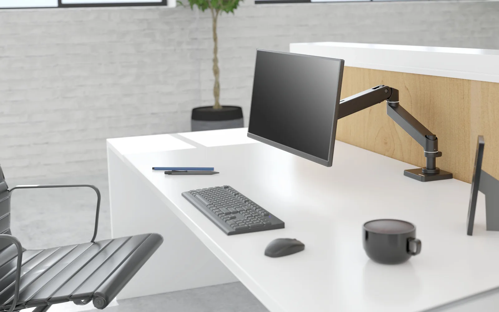 Black Ergotron LX Pro monitor arm holding a display above a white desk with a keyboard and mouse, in a bright office